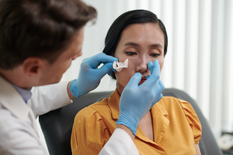 Woman at a private ENT consultation with male surgeon