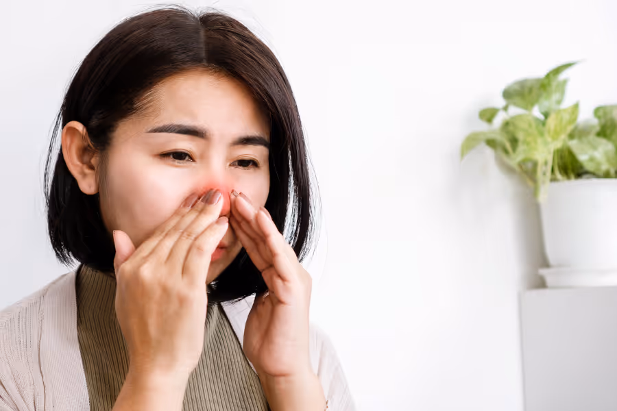 Woman experiencing chronic congestion from polyps