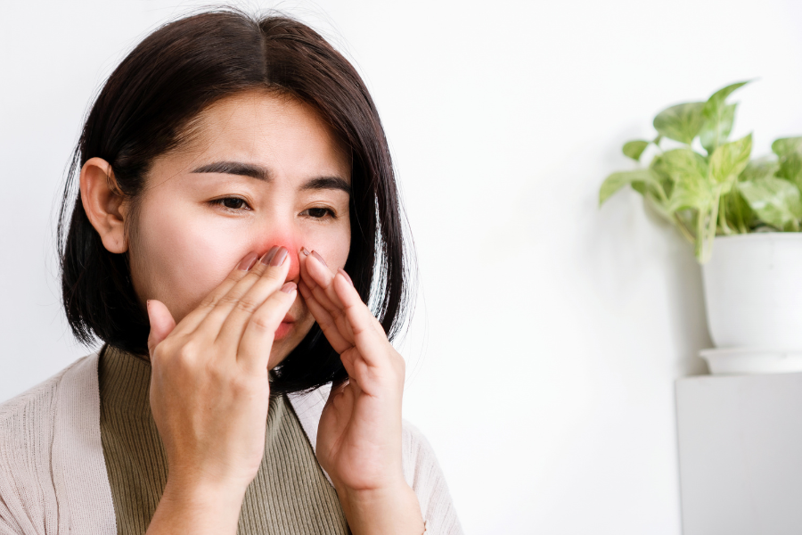 Woman experiencing chronic congestion from polyps