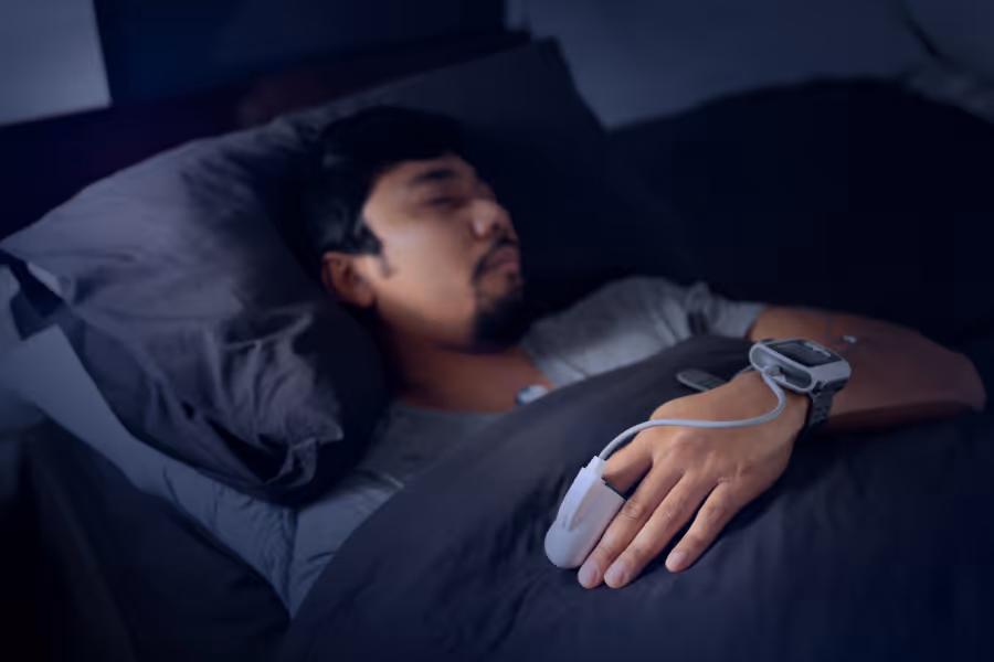 Man performing a sleep study in dark room