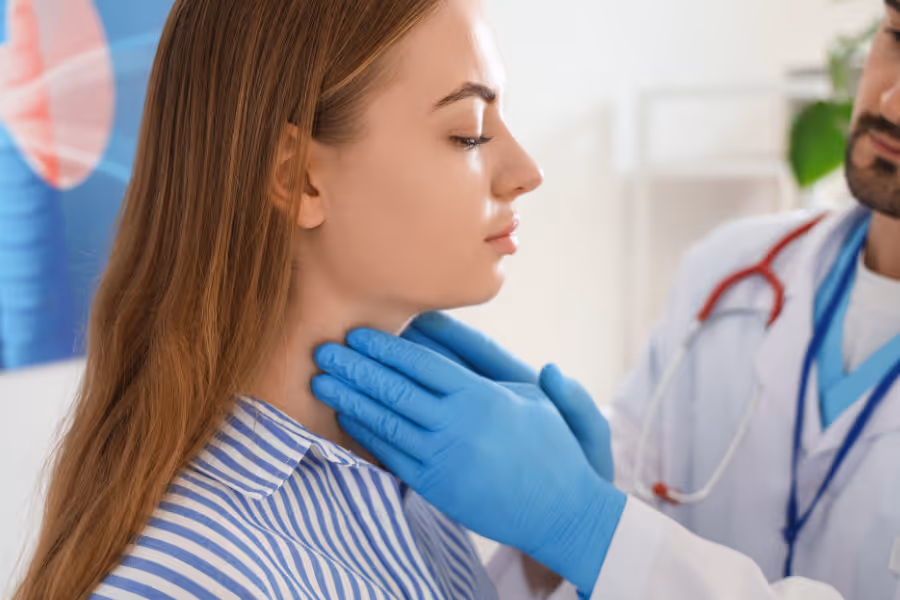 Female patient consulting with ENT for thyroid surgery