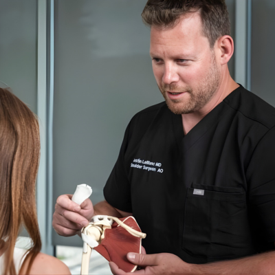 Dr. Justin Leblanc consulting with a female patient