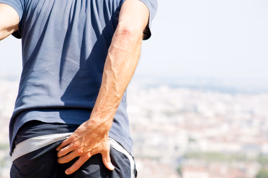 Man in visible anal pain from anal fistula