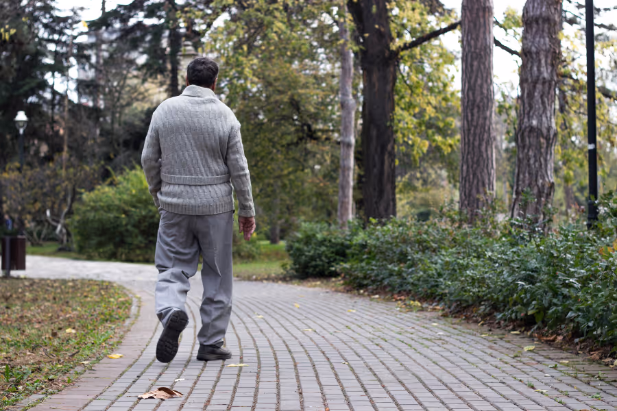 Man walking, recovered from anal fistula surgery