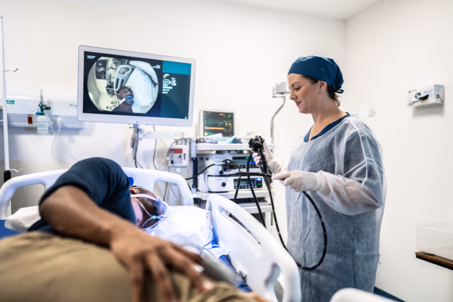 Private endoscopy in a medical clinic setting with female colorectal specialist and male patient