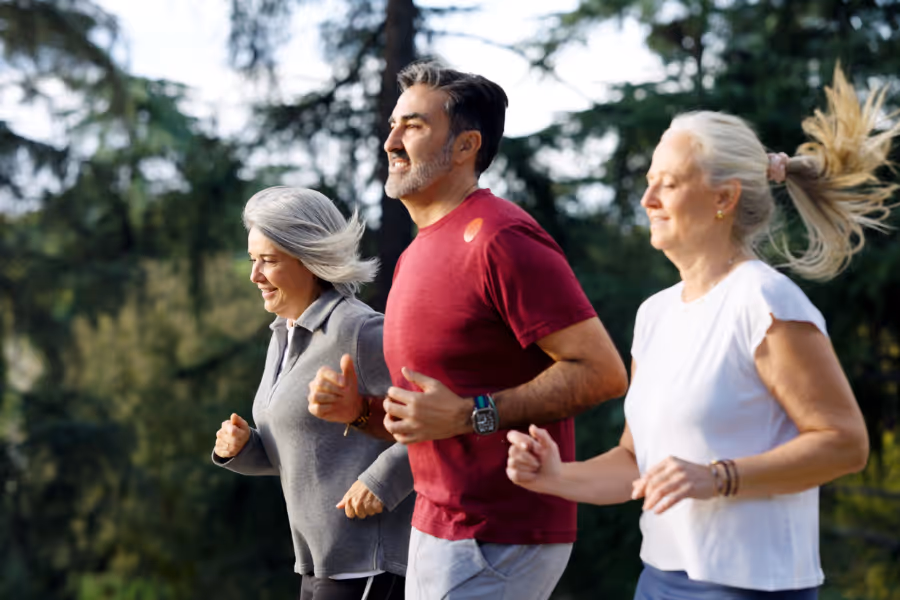 Three older individuals running