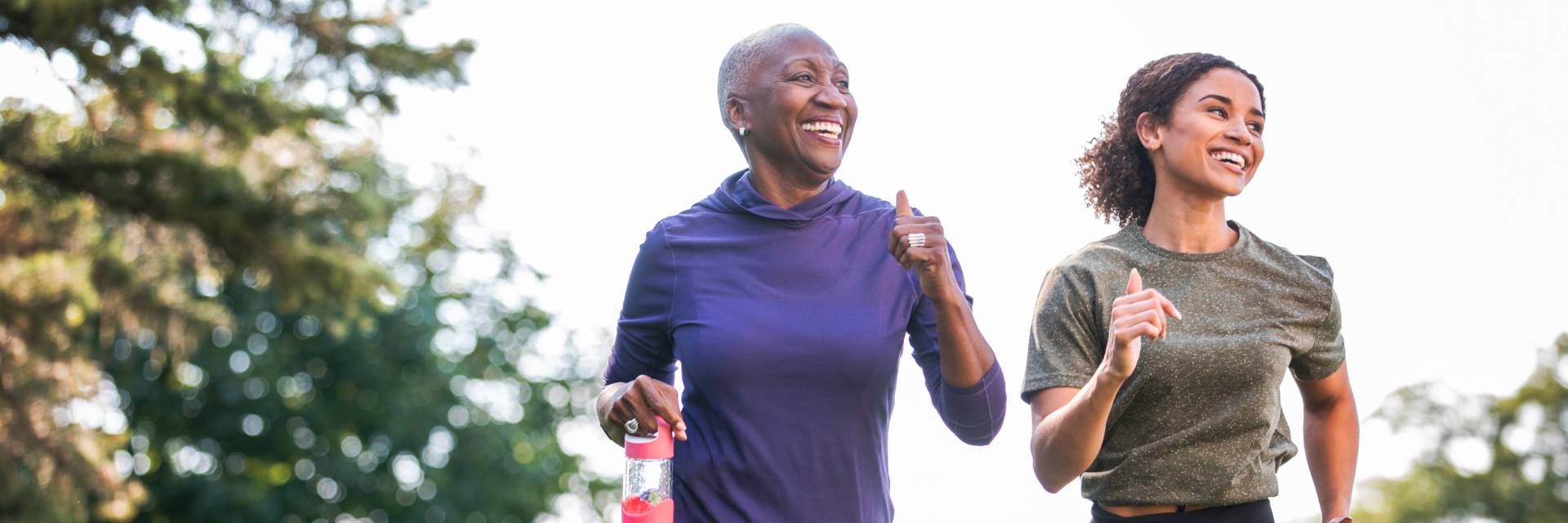 Mother and daughter walking confidently