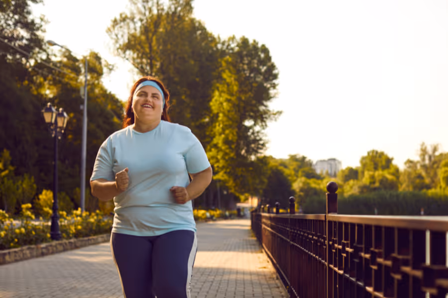 Woman running outside, happy