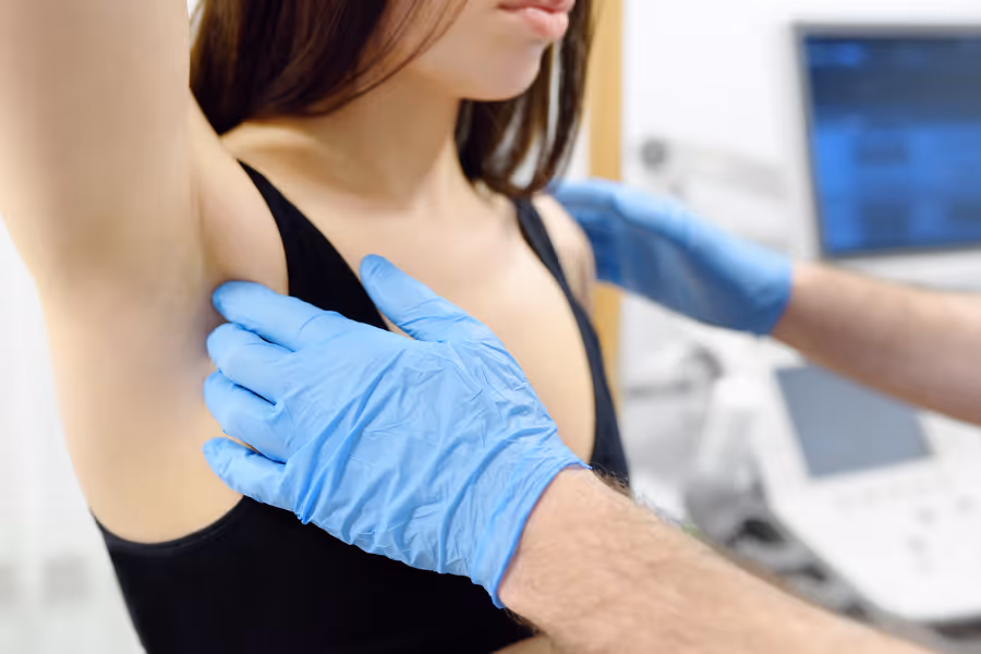 Female patient with cosmetic surgeon pre breast augmentation surgery