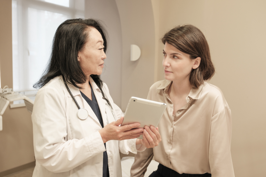 Consultation for staged body contouring between female patient and female cosmetic surgeon