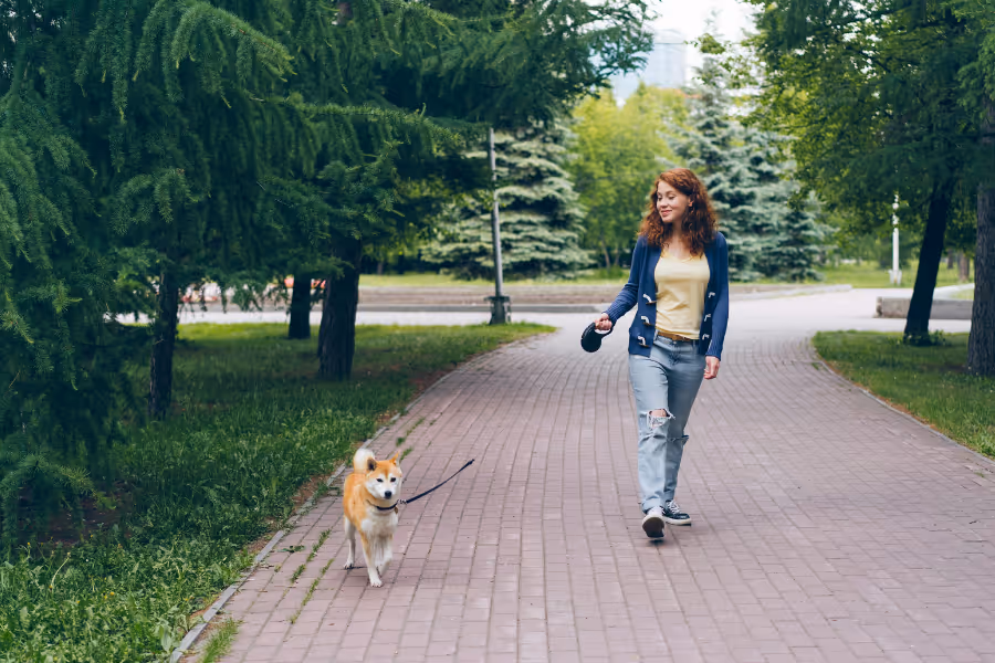 Woman walking happy with her dog