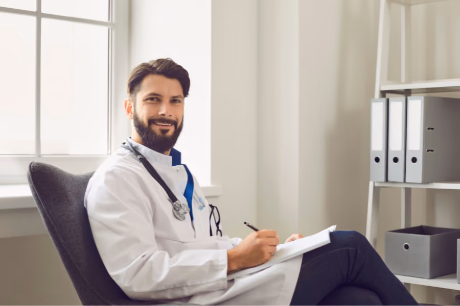 Urologist lounging at office desk