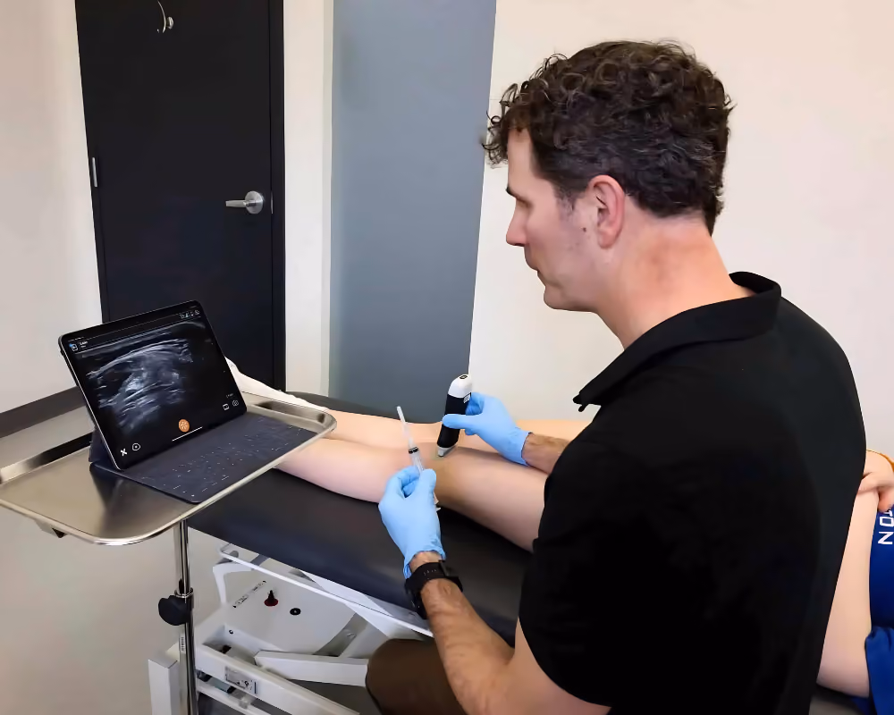 Dr. Myden inspecting patient's medical imaging.