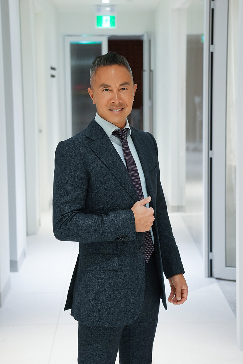 Dr. Nguyen posing at Clinique HG
