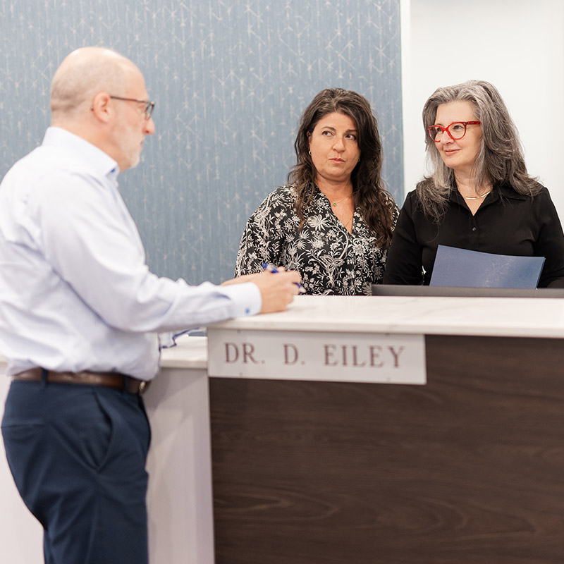 Dr. Eiley conversing with receptionist at Montreal Urology clinic