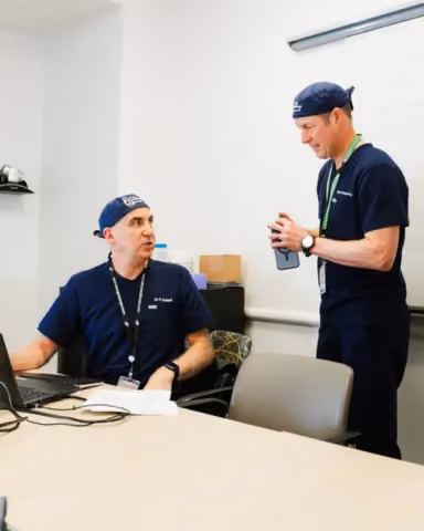 Dr. Zalzal and coh-host Brad Weening in teaching setting