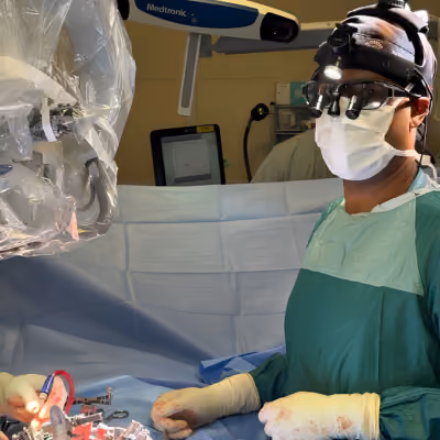 Neuroseurgeon Daipayan Guha operating on a patient in the operating room.