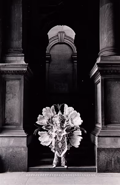 [Mummer in archway of Philadelphia City Hall]
