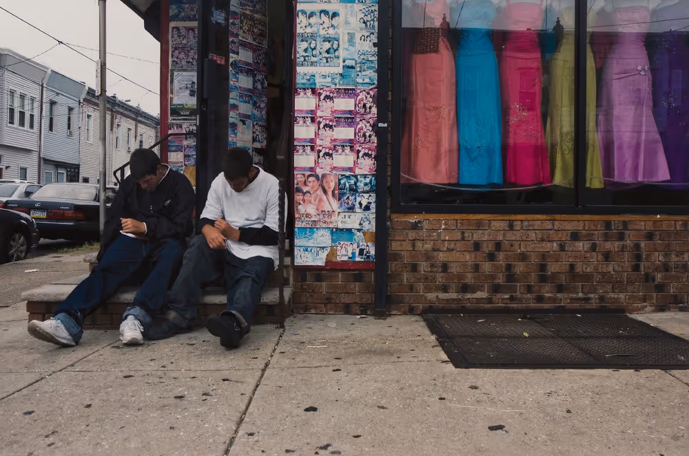 Two Guys Outside Philly Dress Store
