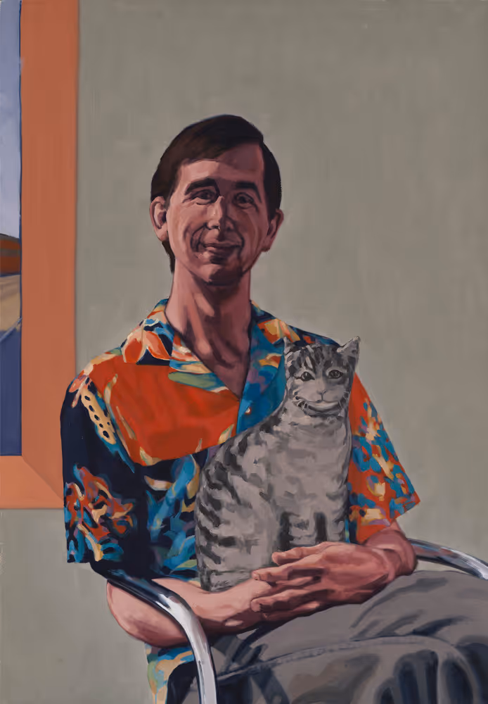 Bill Sawicki Seated in a Chrome Chair with his Stuffed Cat