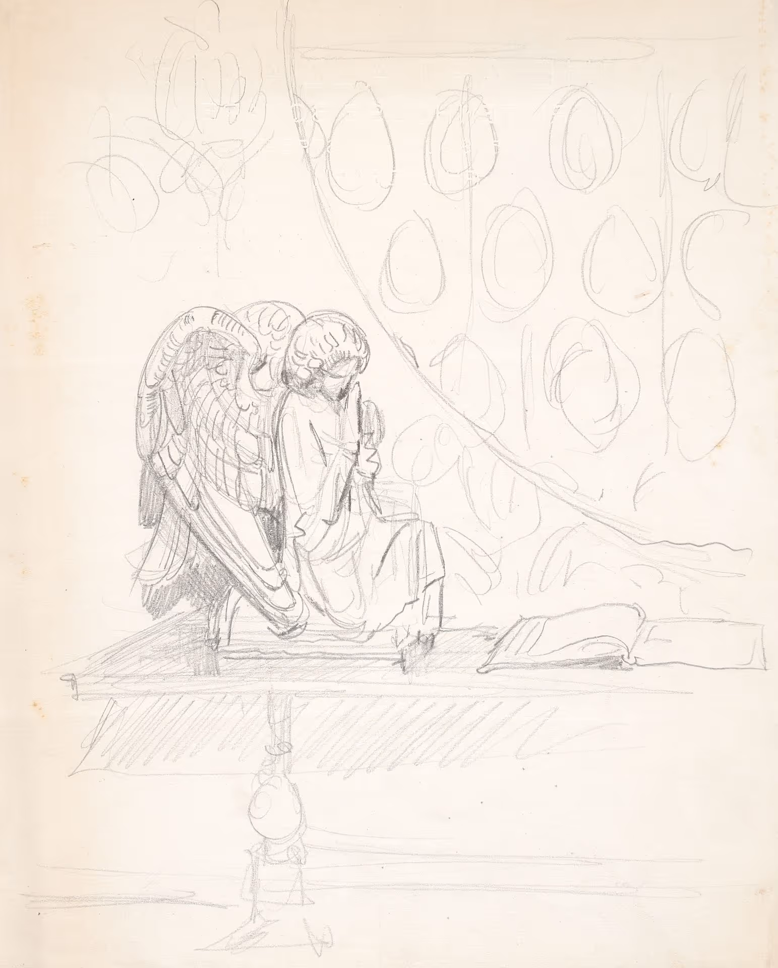 Study of kneeling angel statue and book on table