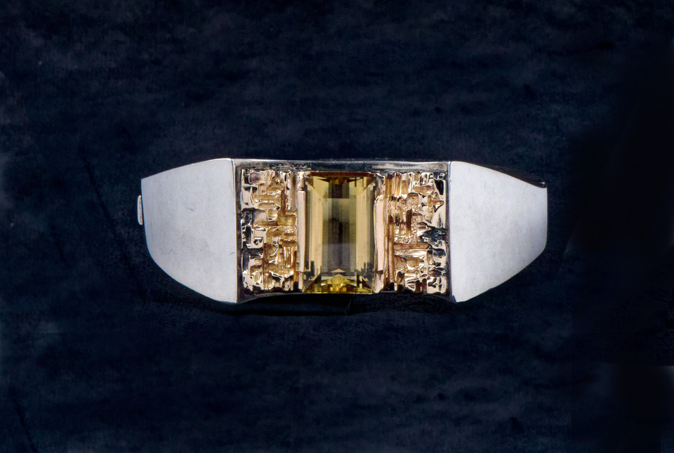 Silver bracelet inlaid with intricate gold designs