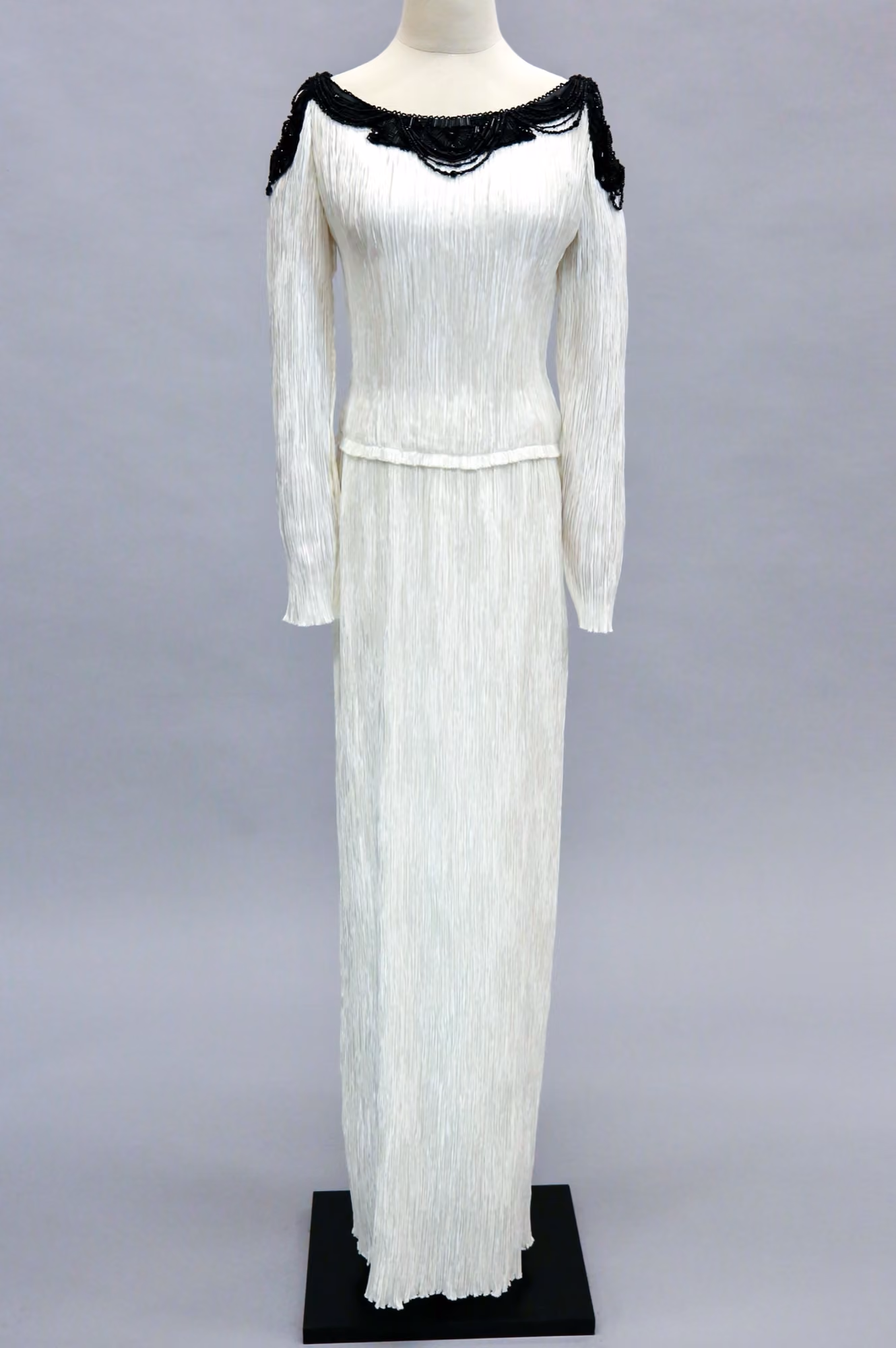 White & black pleated evening gown