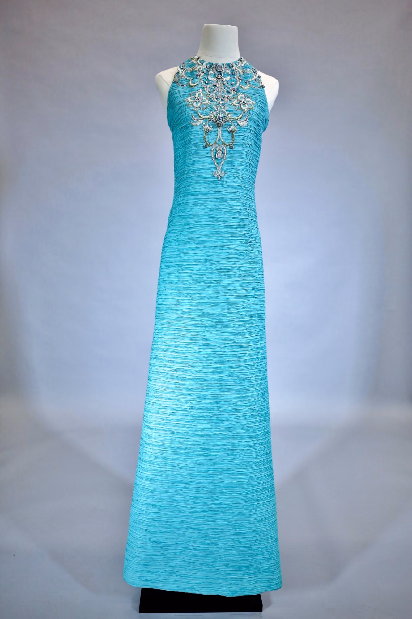 Turquoise pleated evening gown