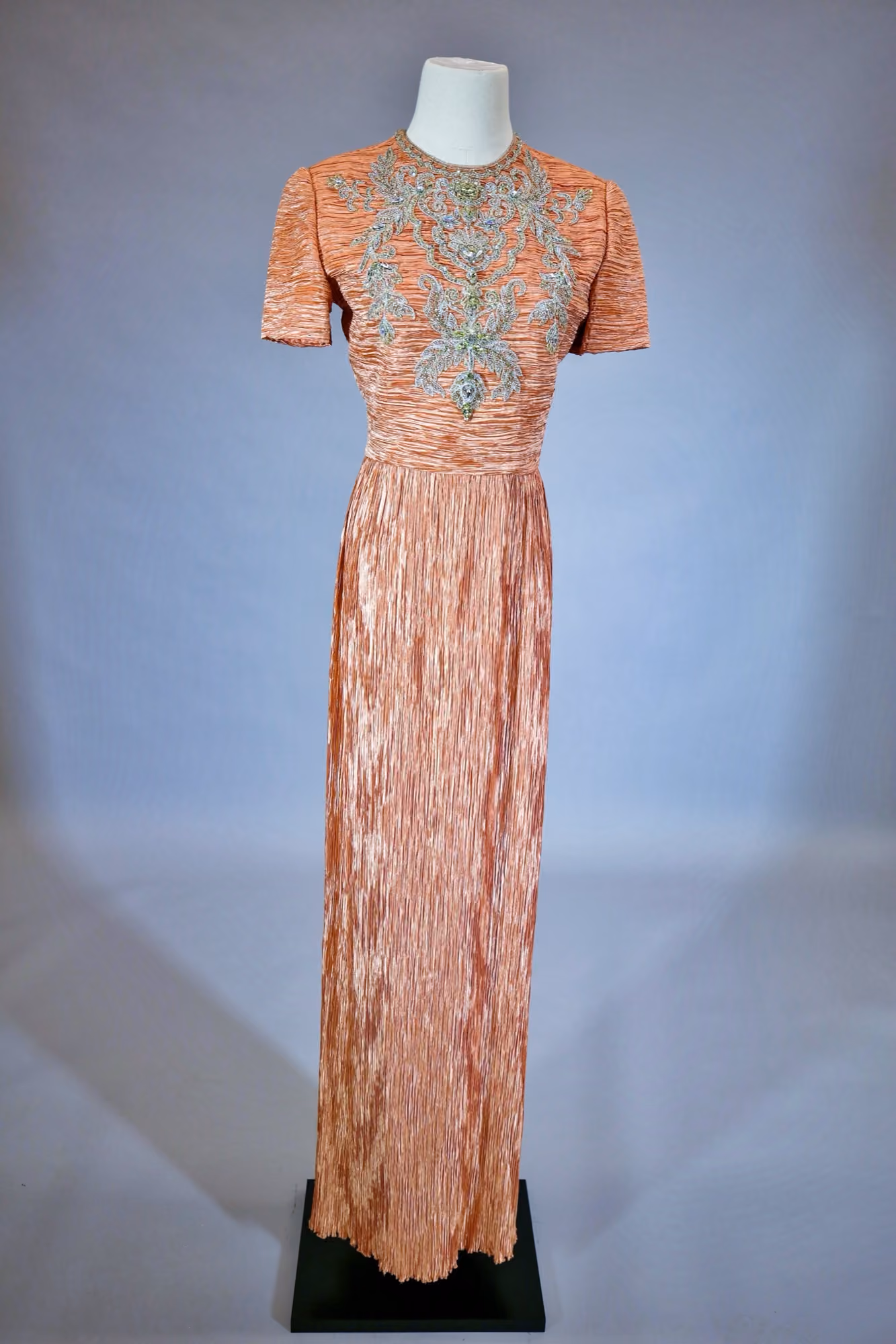 Peach pleated & embellished evening gown