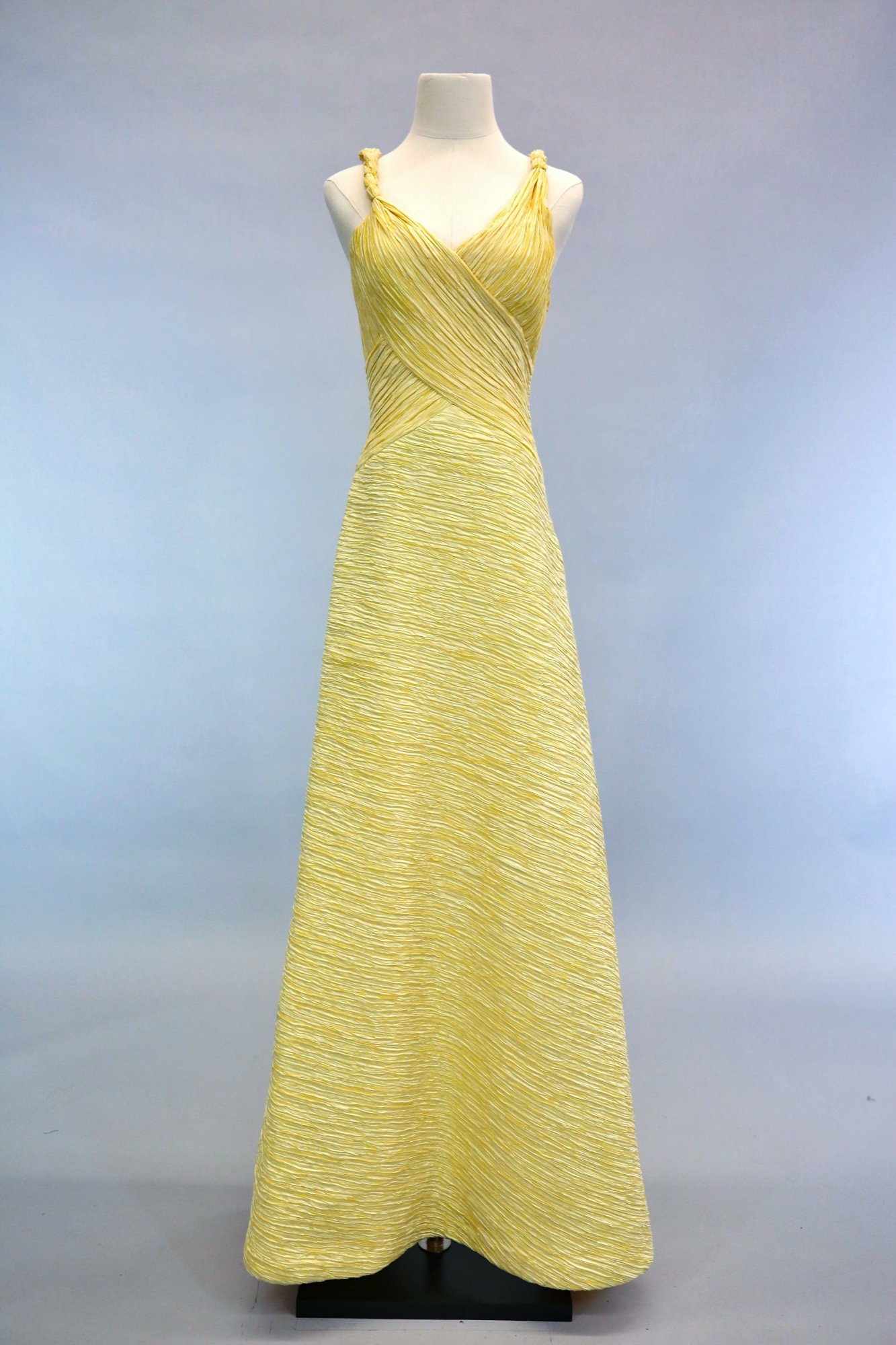 Yellow pleated evening gown