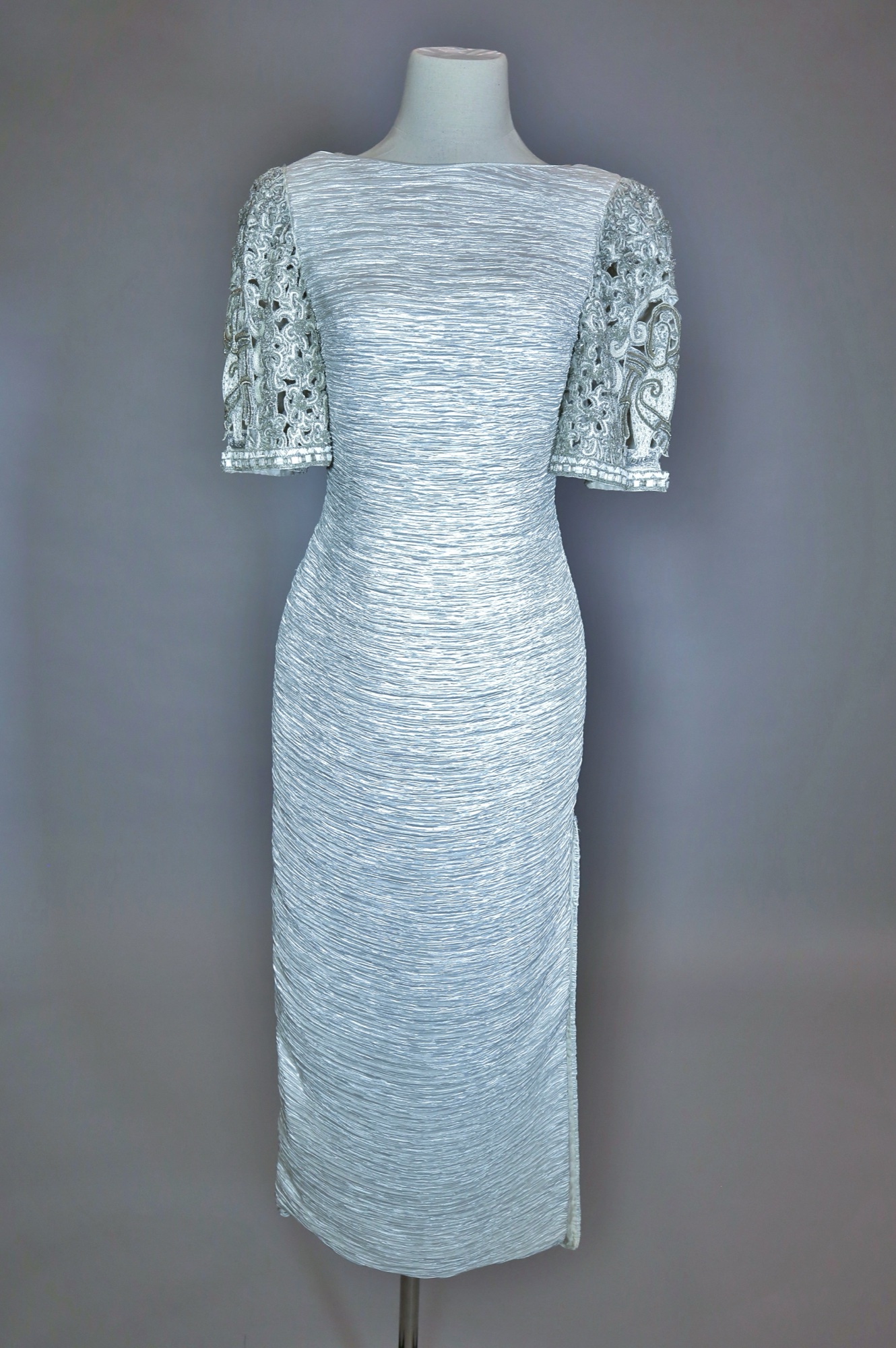 White pleated & flower embellished evening gown