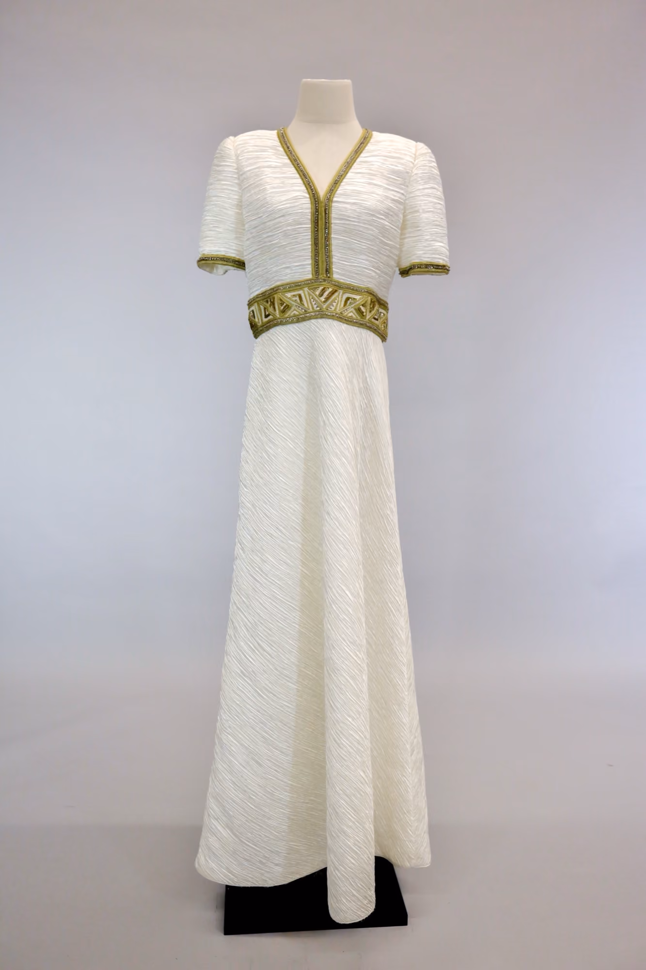 White & gold geometric pleated evening gown