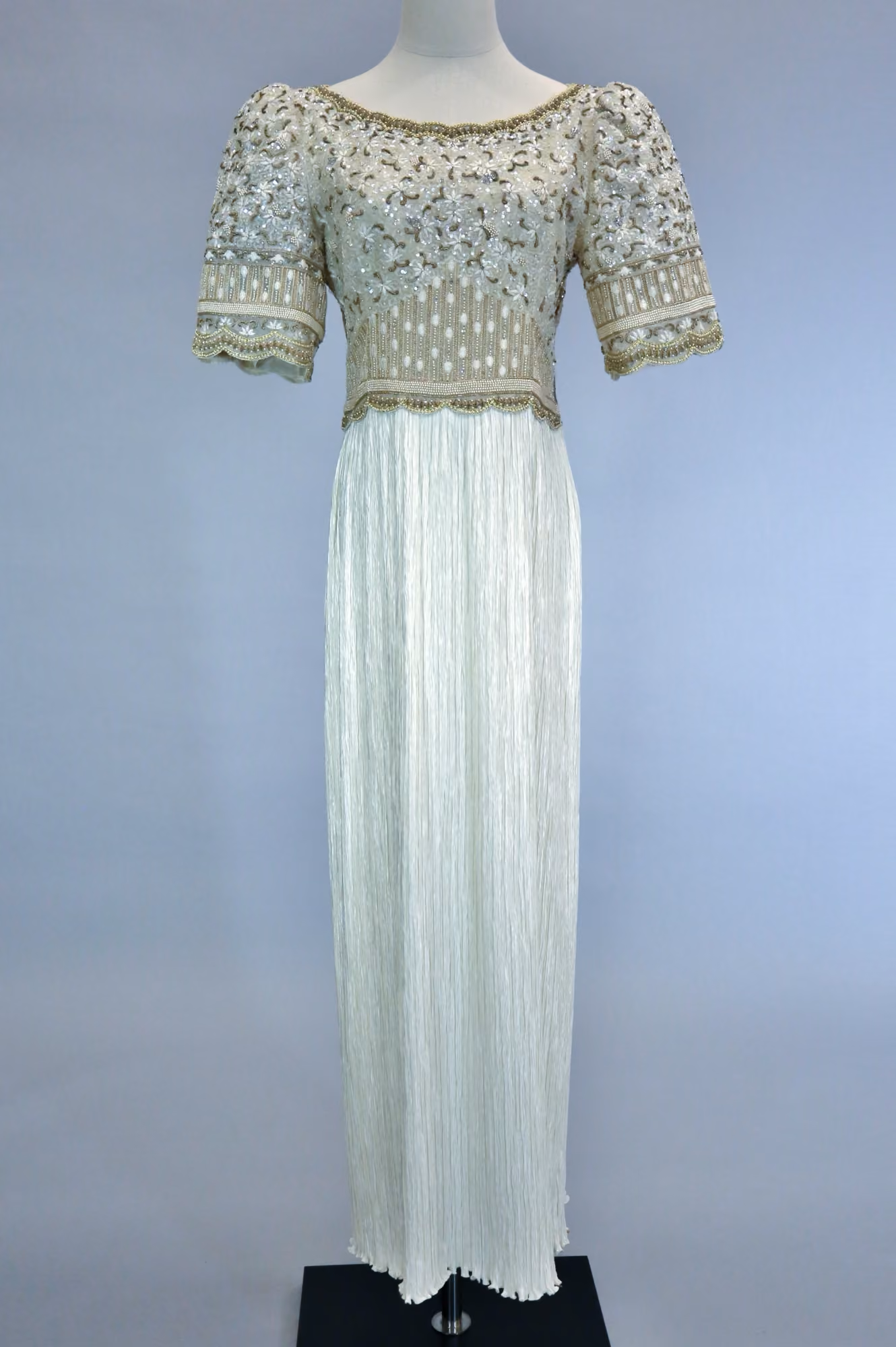 White & gold embellished pleated evening gown