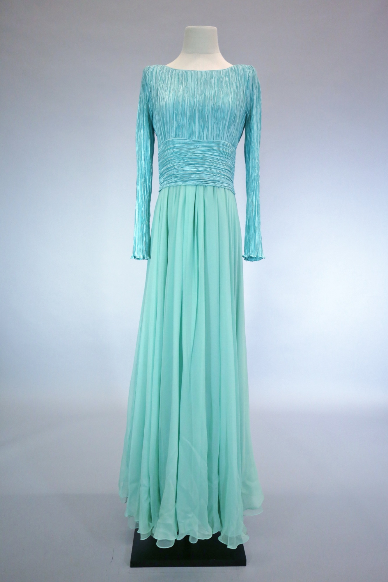 Turquoise pleated evening gown
