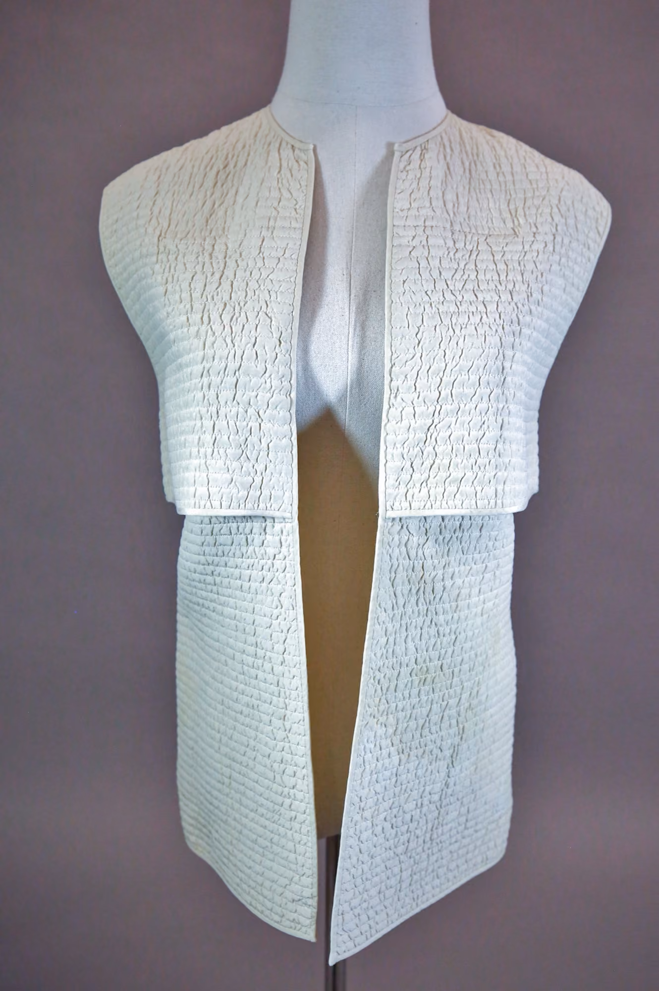 White quilted vest