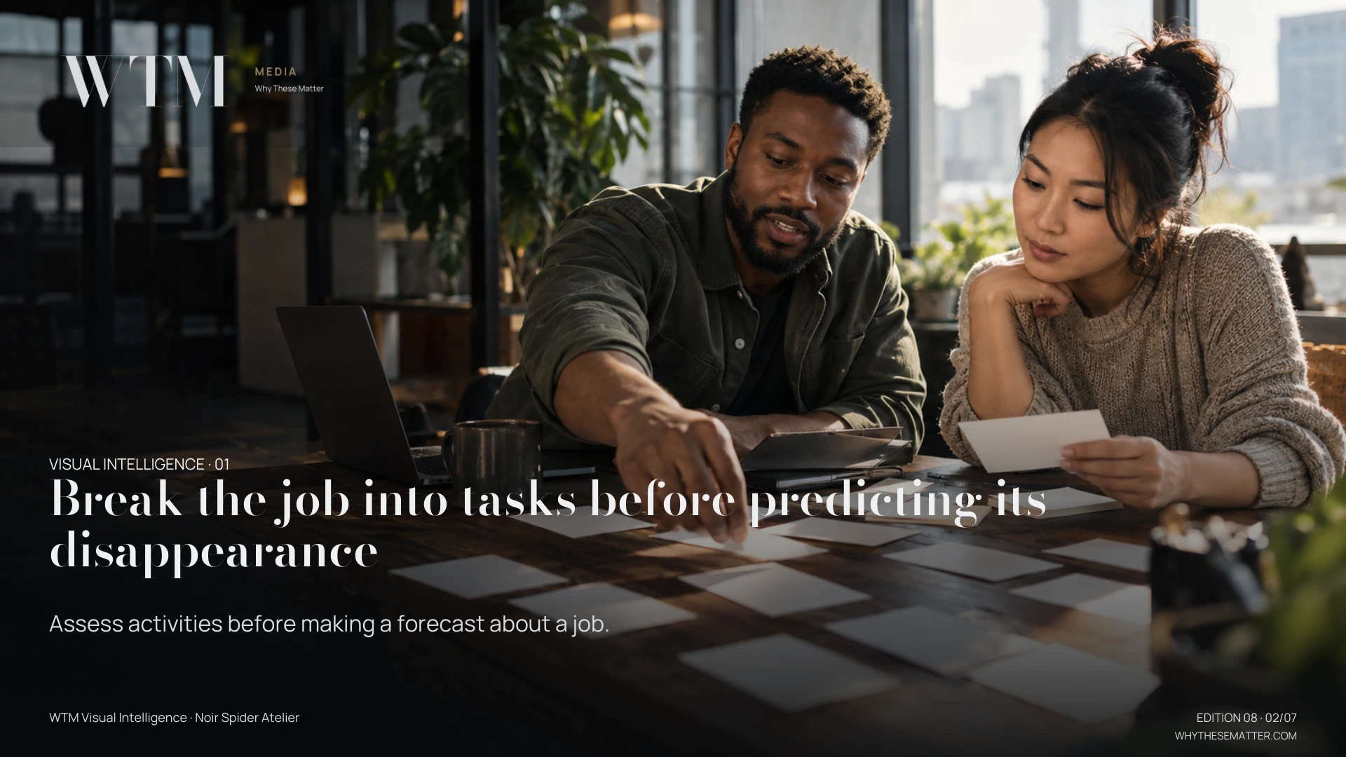 Illustrative scene: a Black male operations worker and Asian woman colleague mapping a real desk workflow with plain index cards, no readable text. Decision: Assess activities before making a forecast about a job.