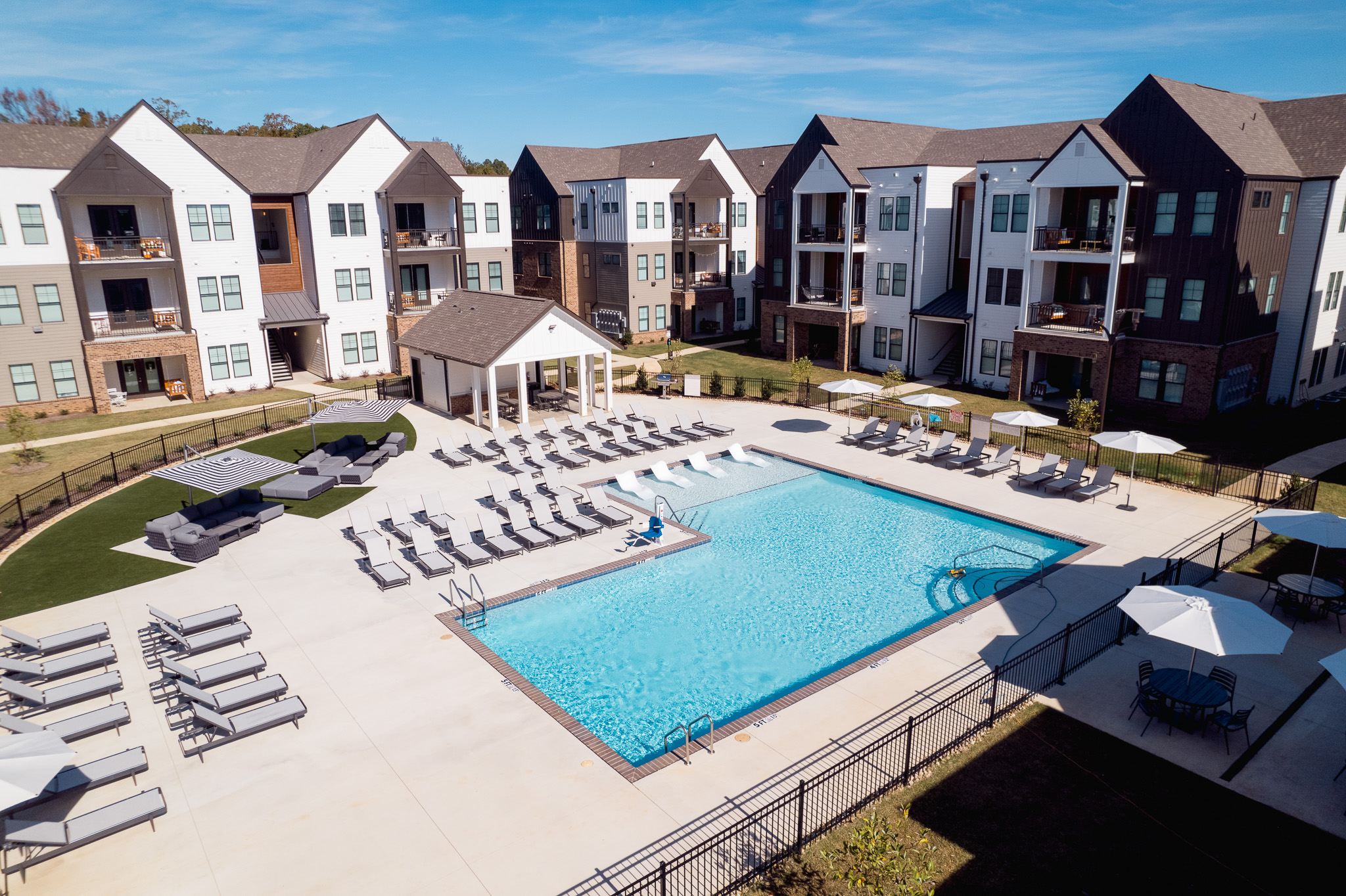 Birds eye view of exterior and swimming pool