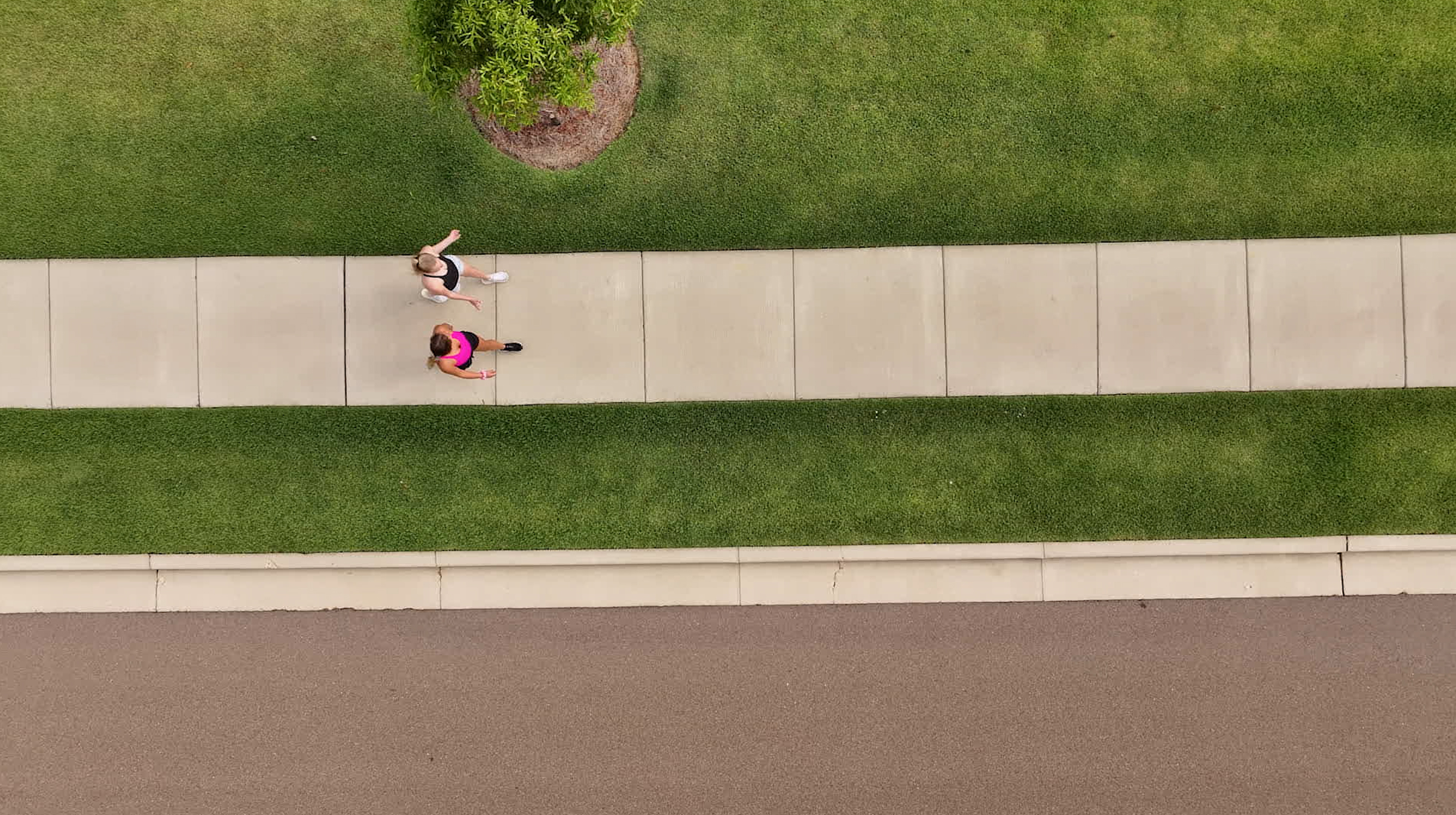girls walking trail birds eye view