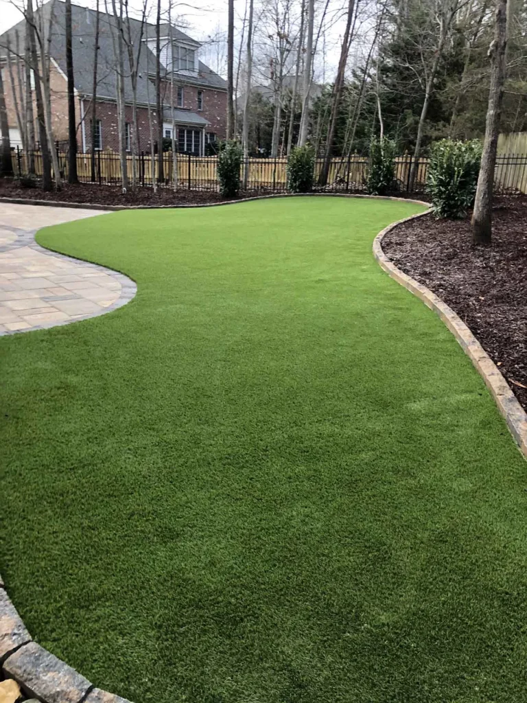 beautiful photo of an urban house with artificial turf