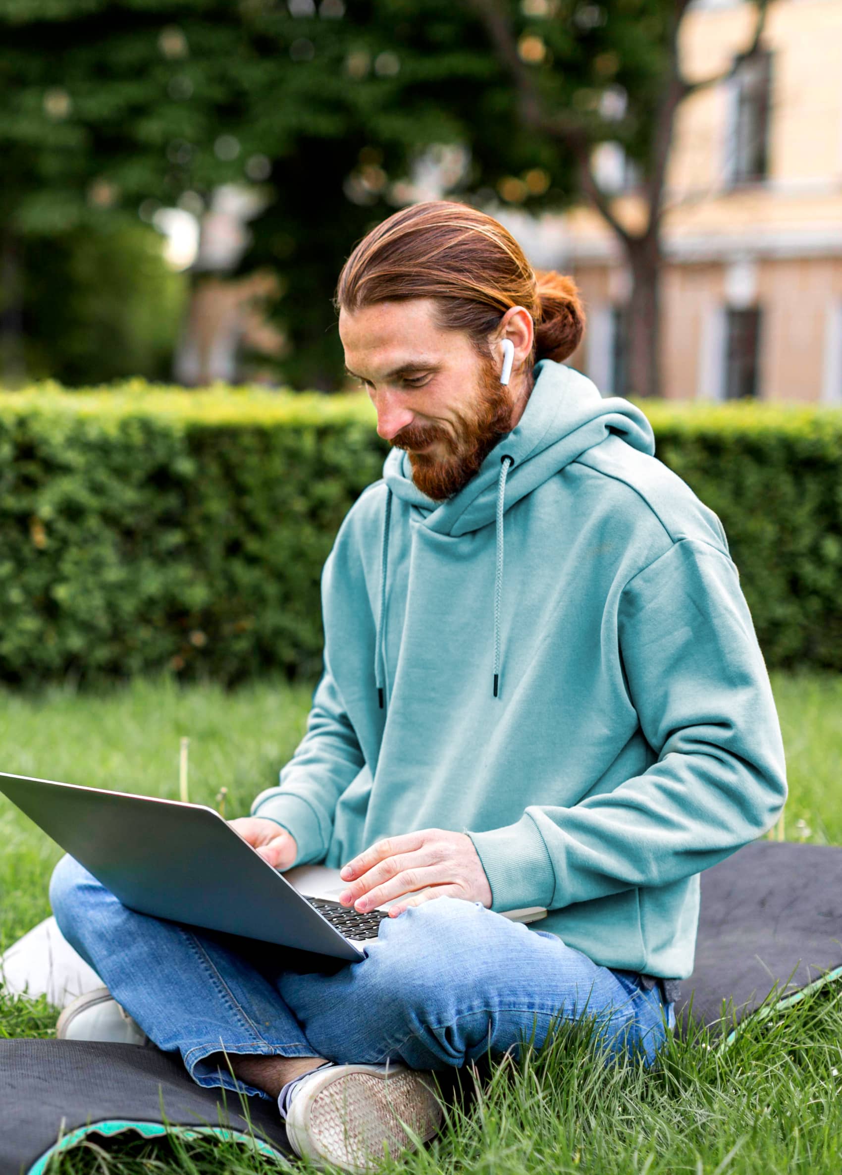 Man Listening Music And Working Remotely - Biotech X Webflow Template