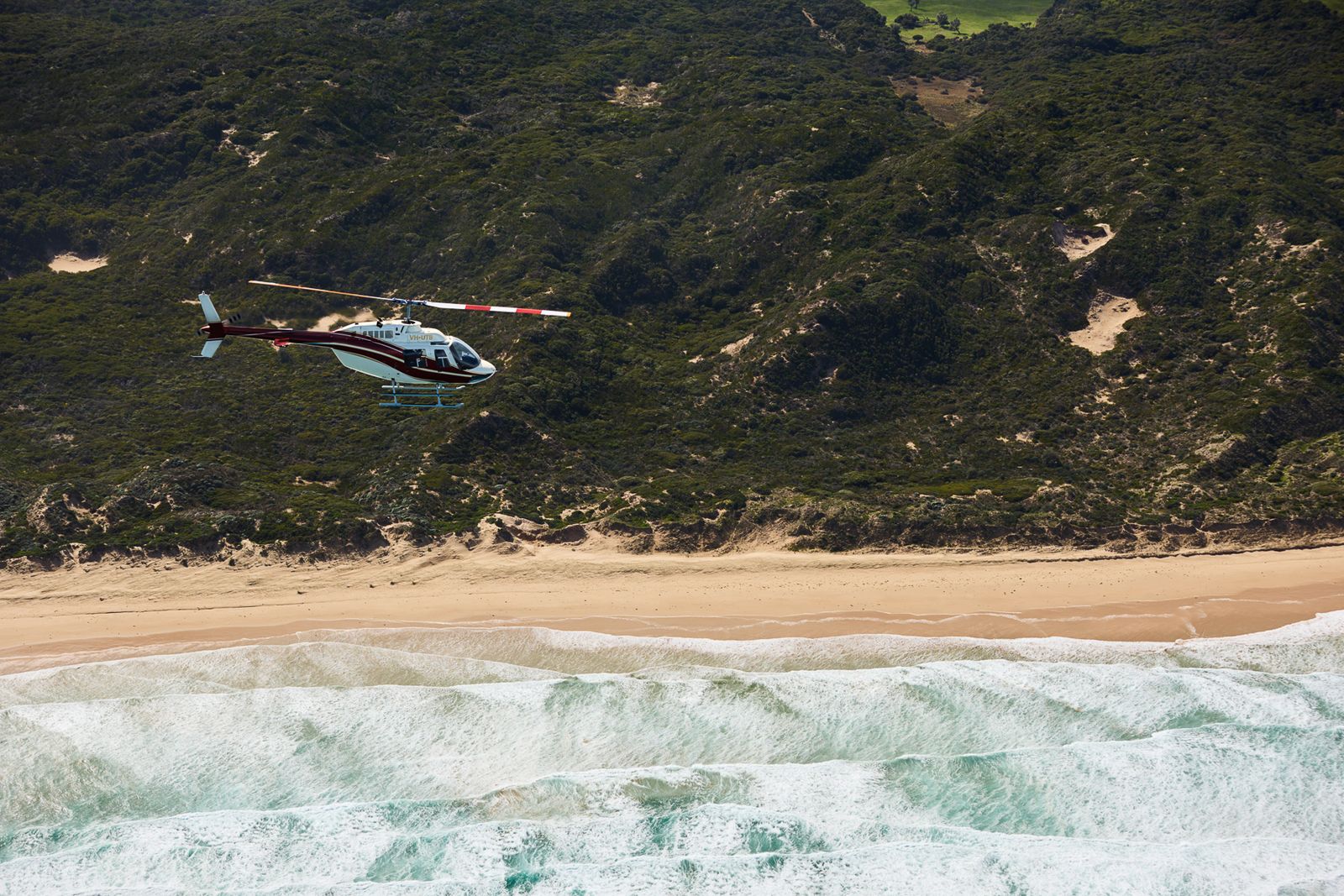 Helicopter flying over ocean