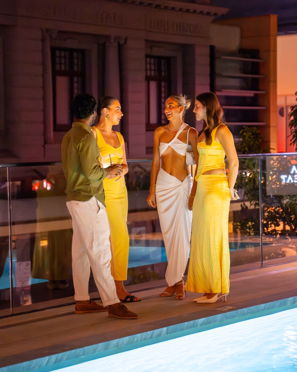 Guests chatting by the pool at a BAHA Perth event