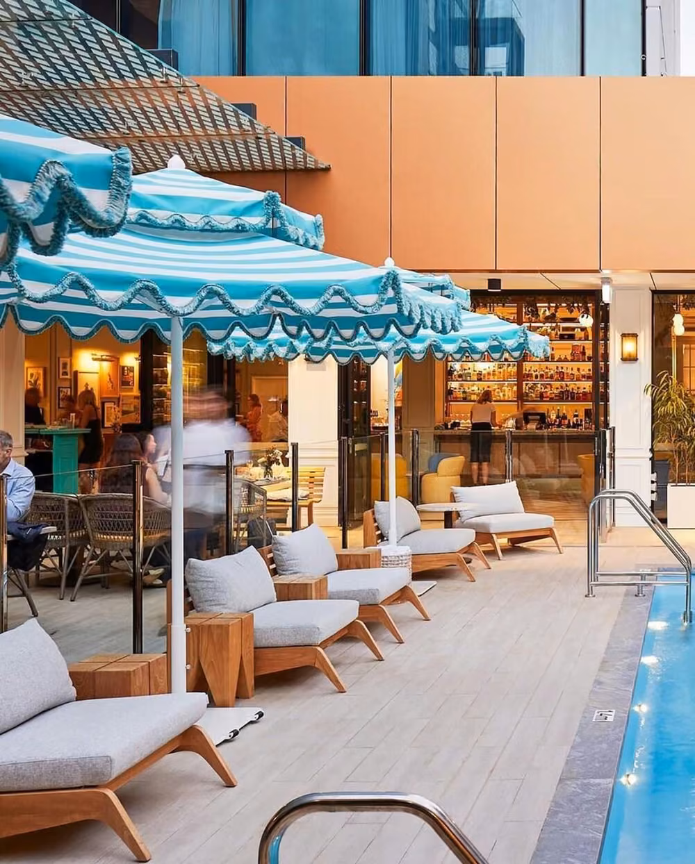 Outdoor pool area with lounge chairs at BAHA Perth