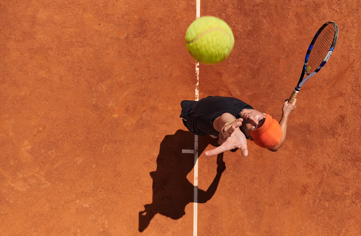 tennis player serving a shot