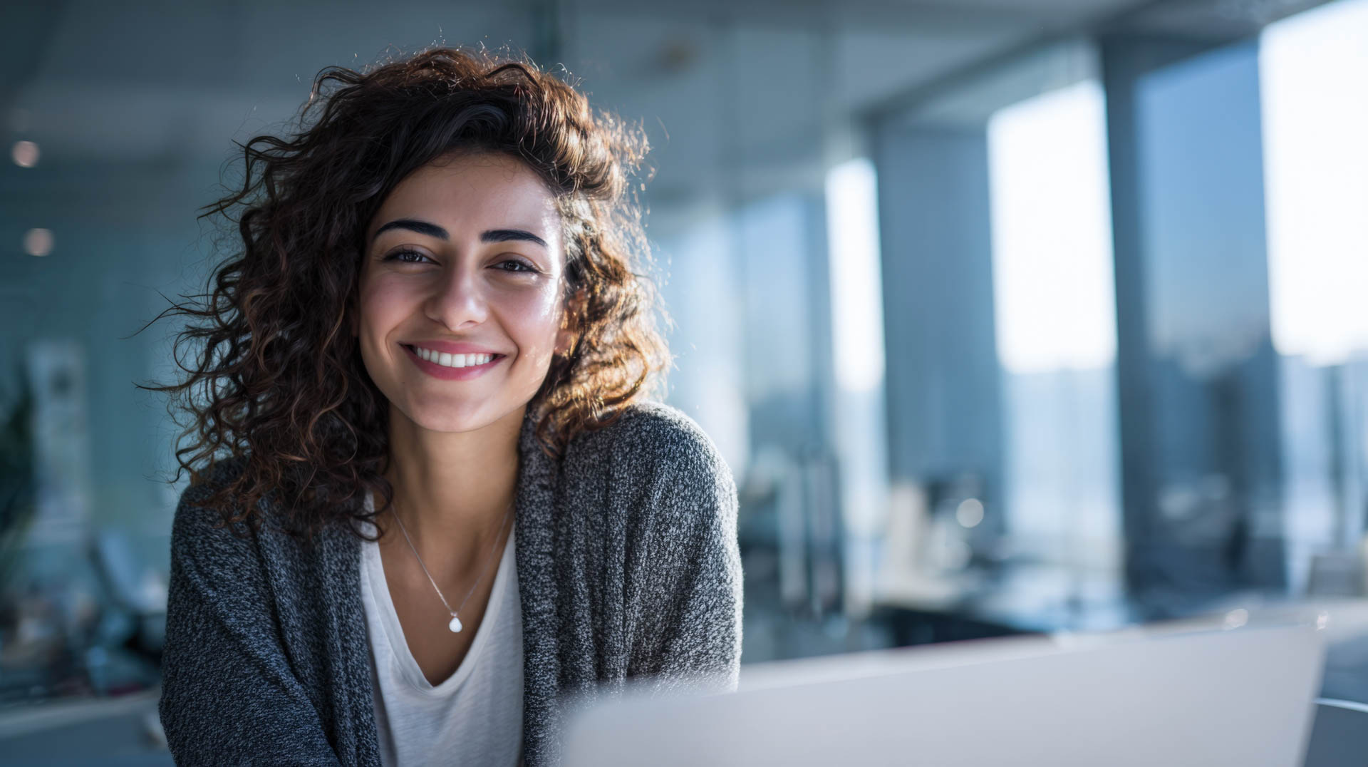 a smiling woman in an office
