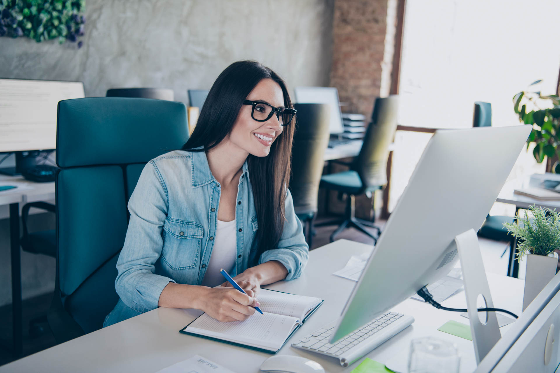a women working on a computer in a modern office