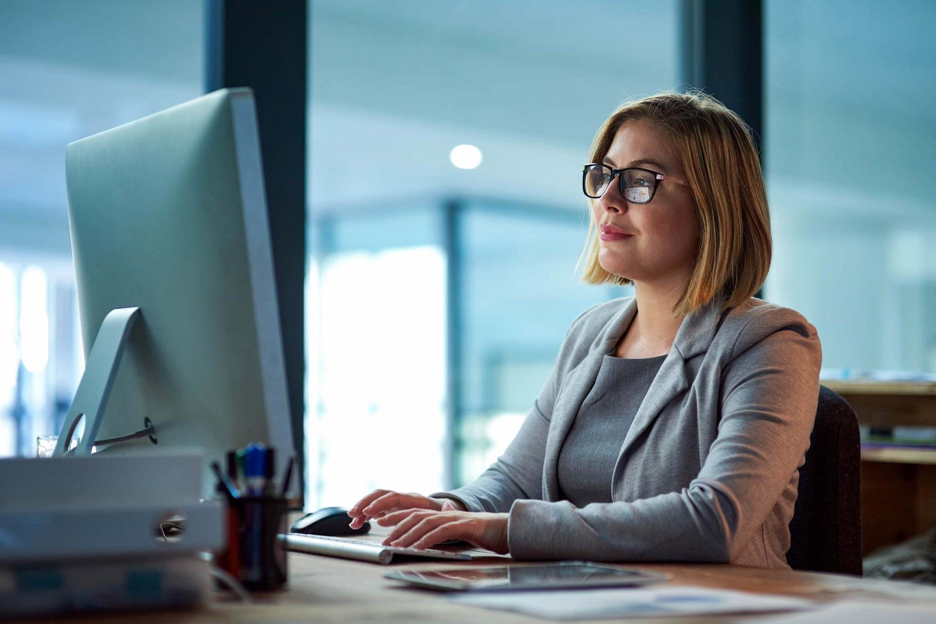 a women working on a computer in a modern office