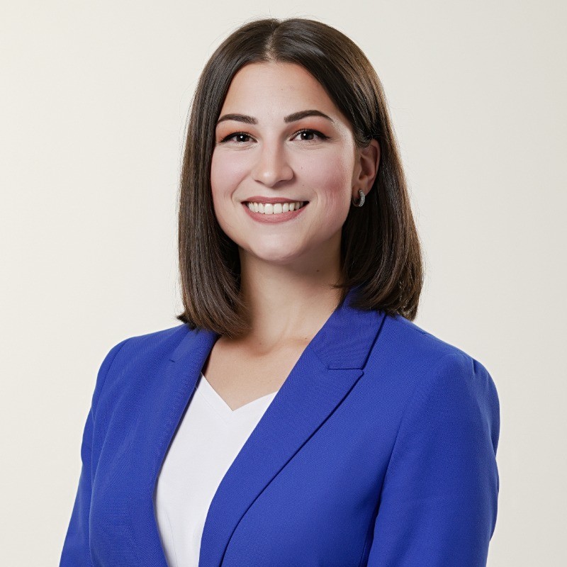 portrait of a smiling women in a blue blaser
