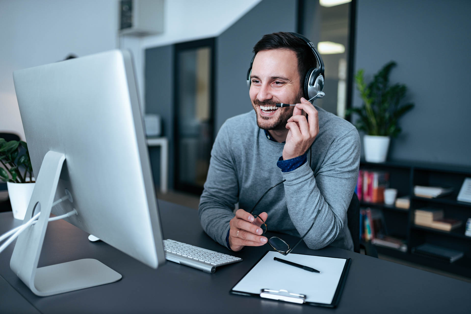 man in front of a computer