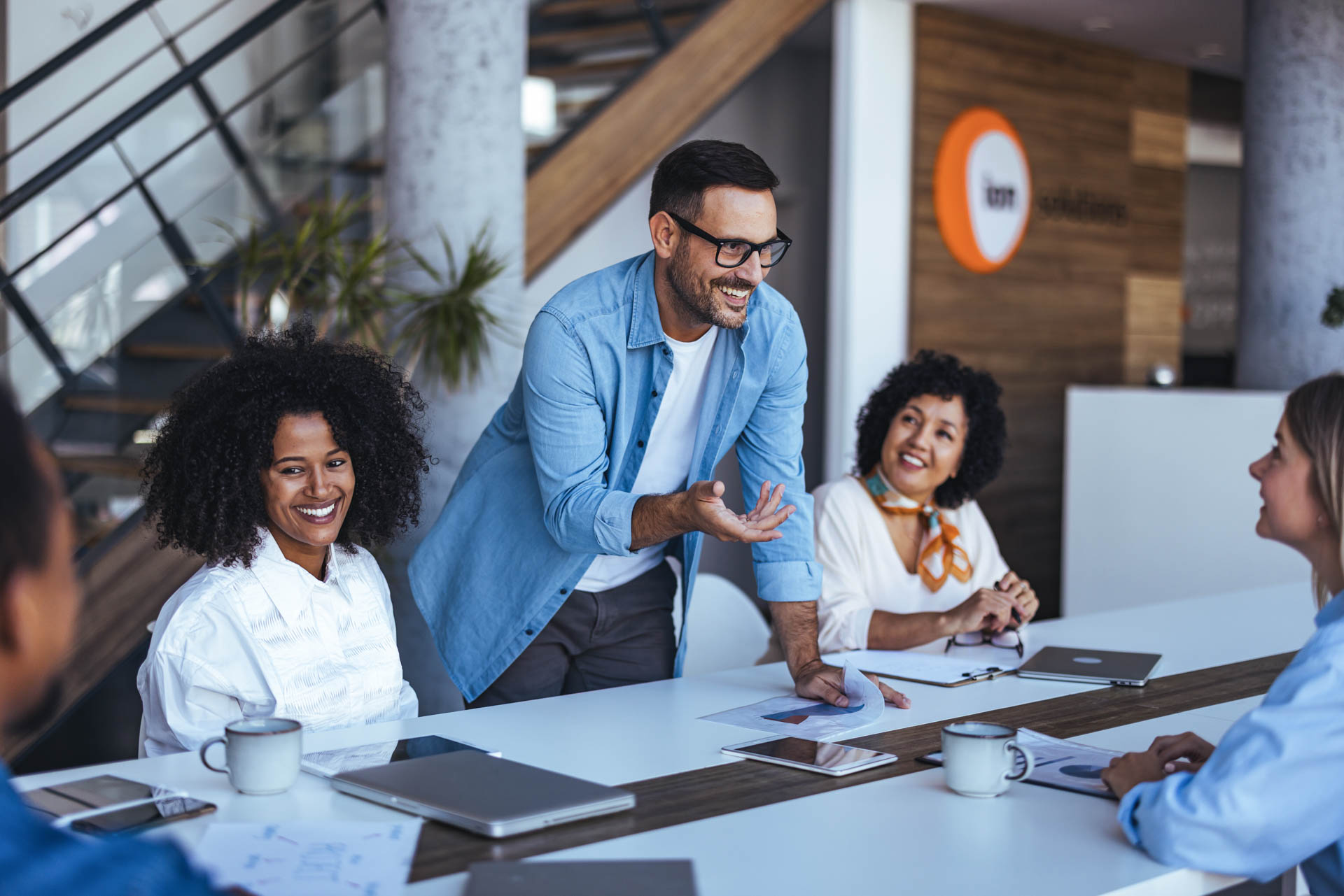 group of 5 people working in an office